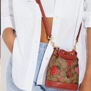 NWOT Coach Dempsey strawberry drawstring crossbody